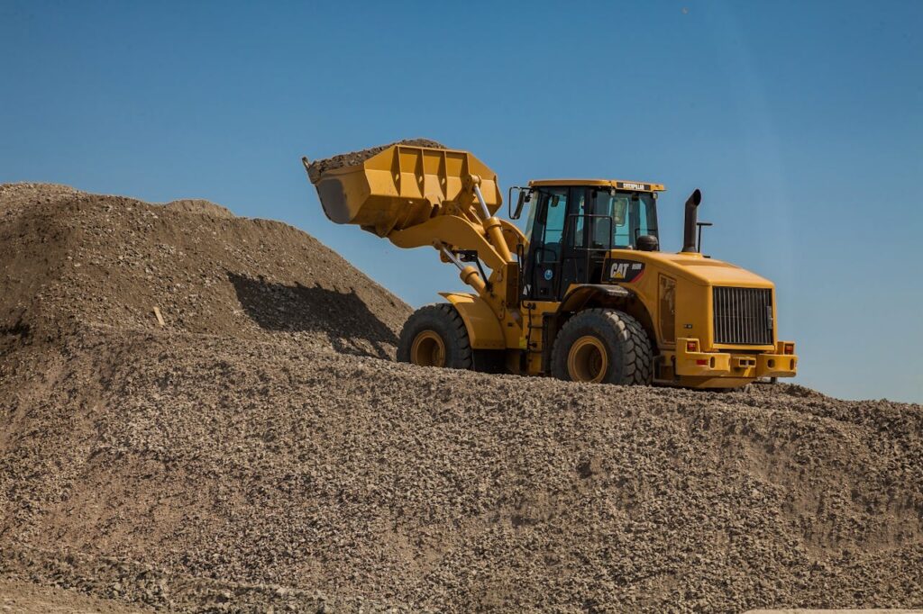The Art of Drawing Readers In: Your attractive post title goes here A large wheel loader moving gravel at an outdoor construction site.